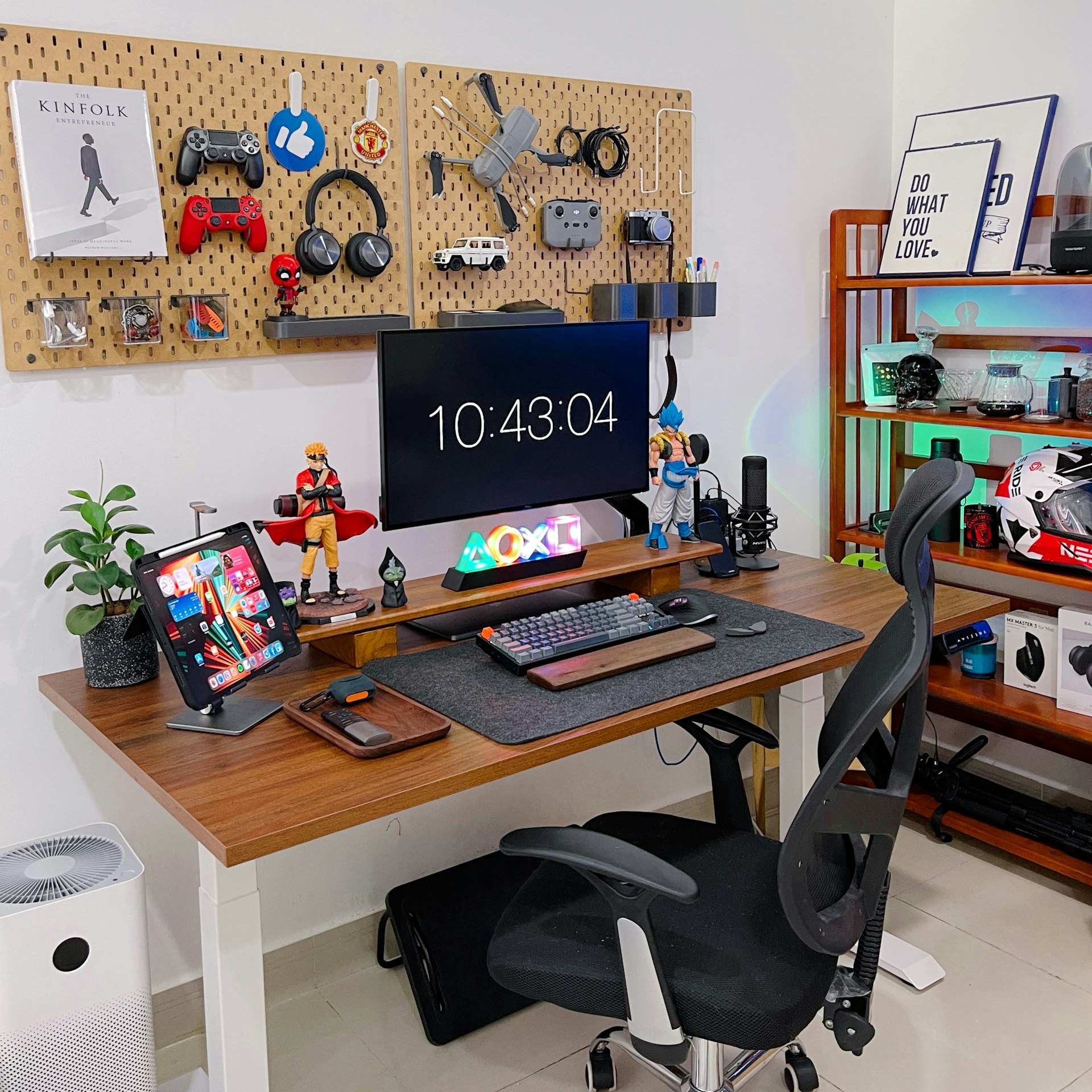 a desk with a computer and a laptop on it